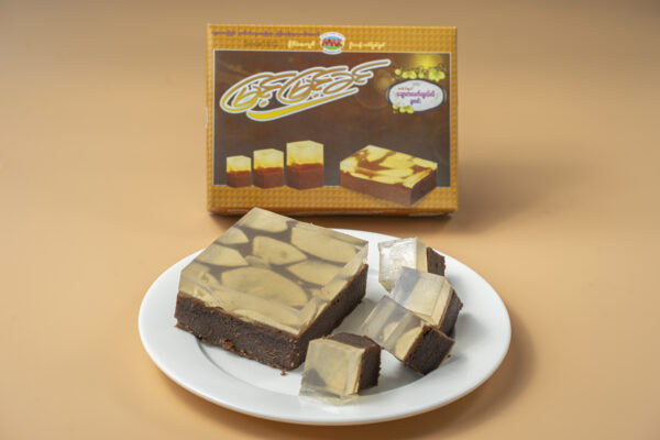 Slices of Myint Myint Khin chocolate jelly pudding on a white plate — a dark chocolate base under a pale translucent jelly layer